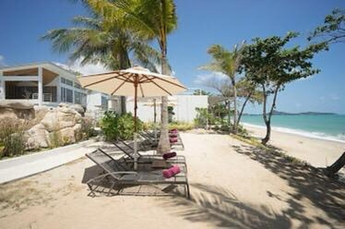 Sun loungers and a parasol on the resort beach
