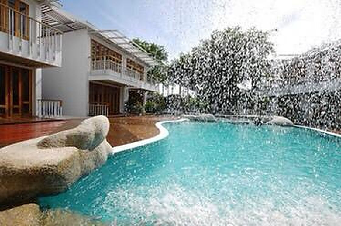 The second pool, built into a rock face with falling water