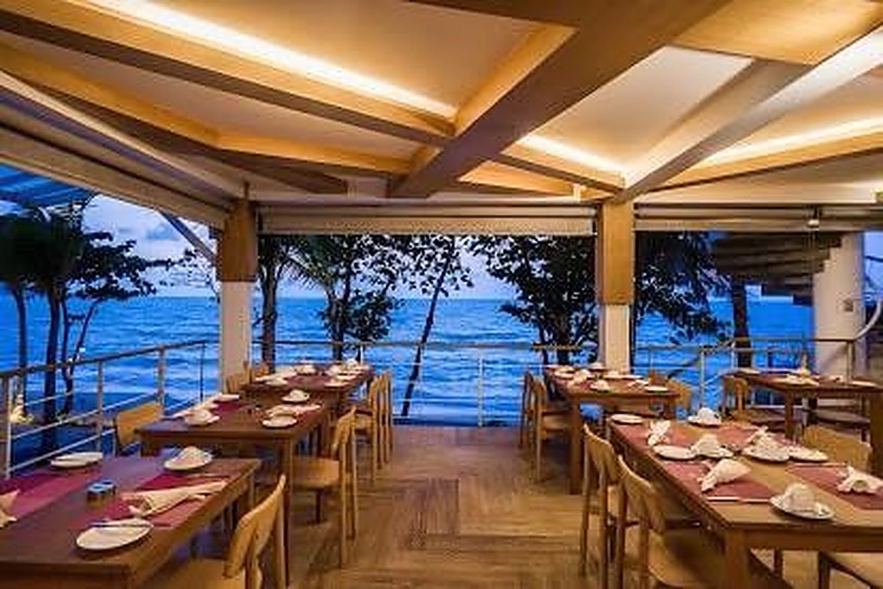 Restaurant terrace open to the sea at dusk