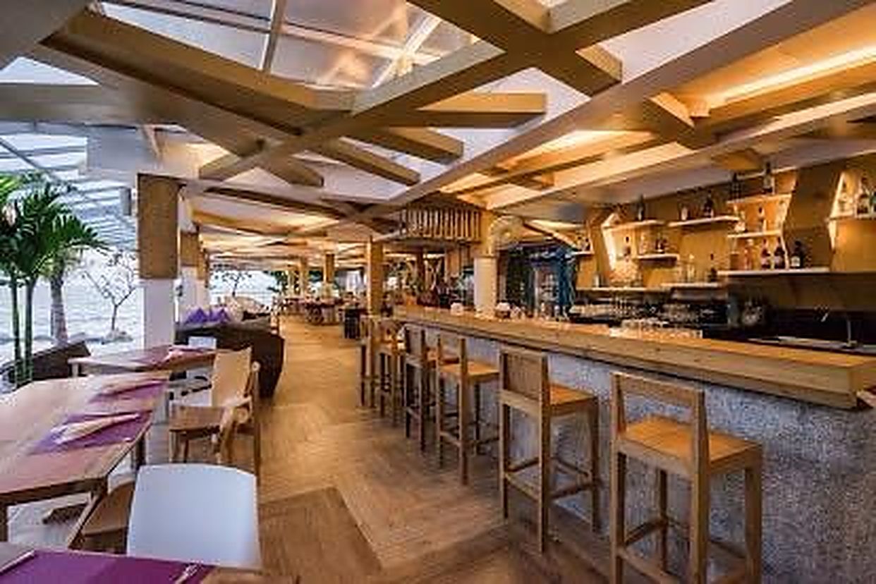 Bar counter and stools beside the restaurant