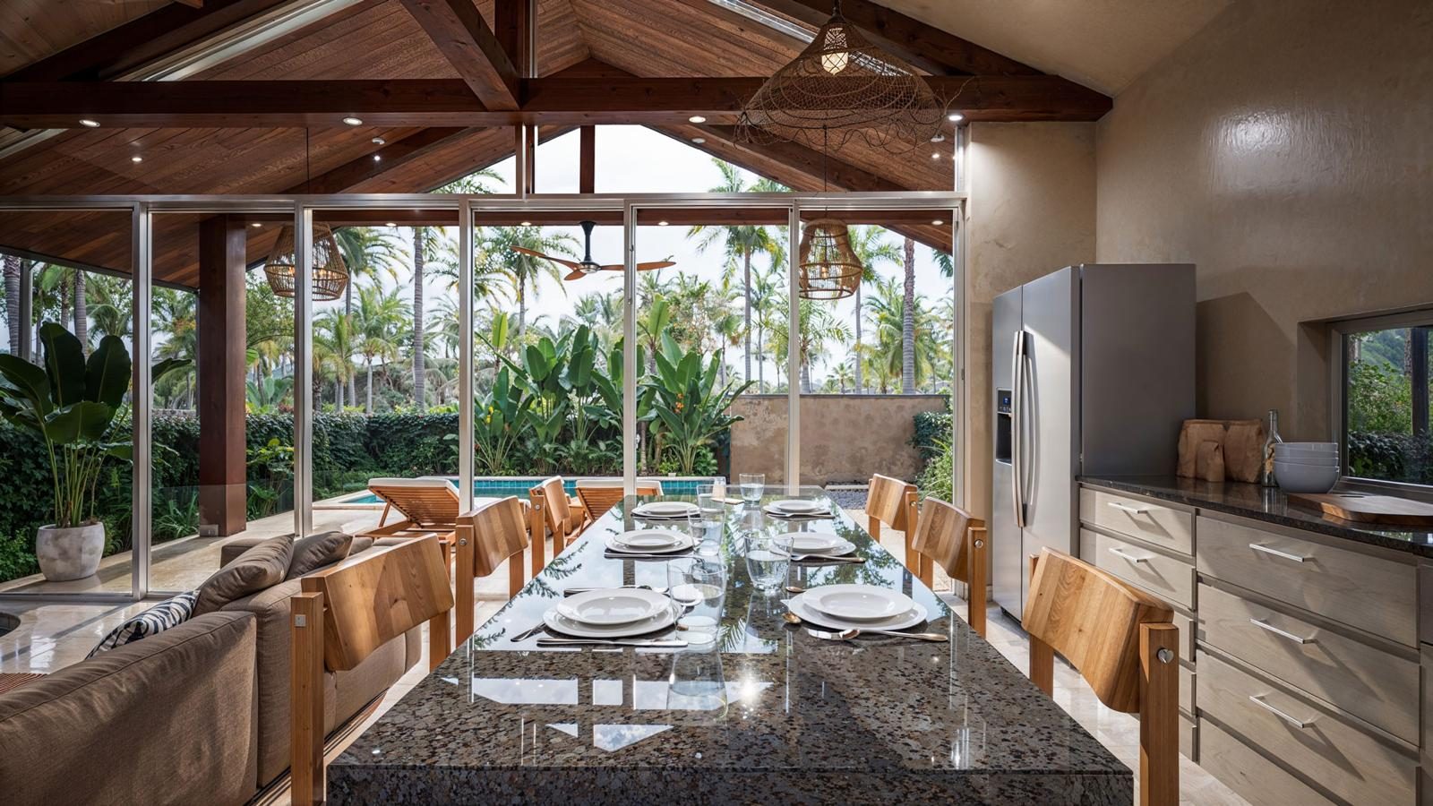 Indoor-outdoor dining area set for a meal