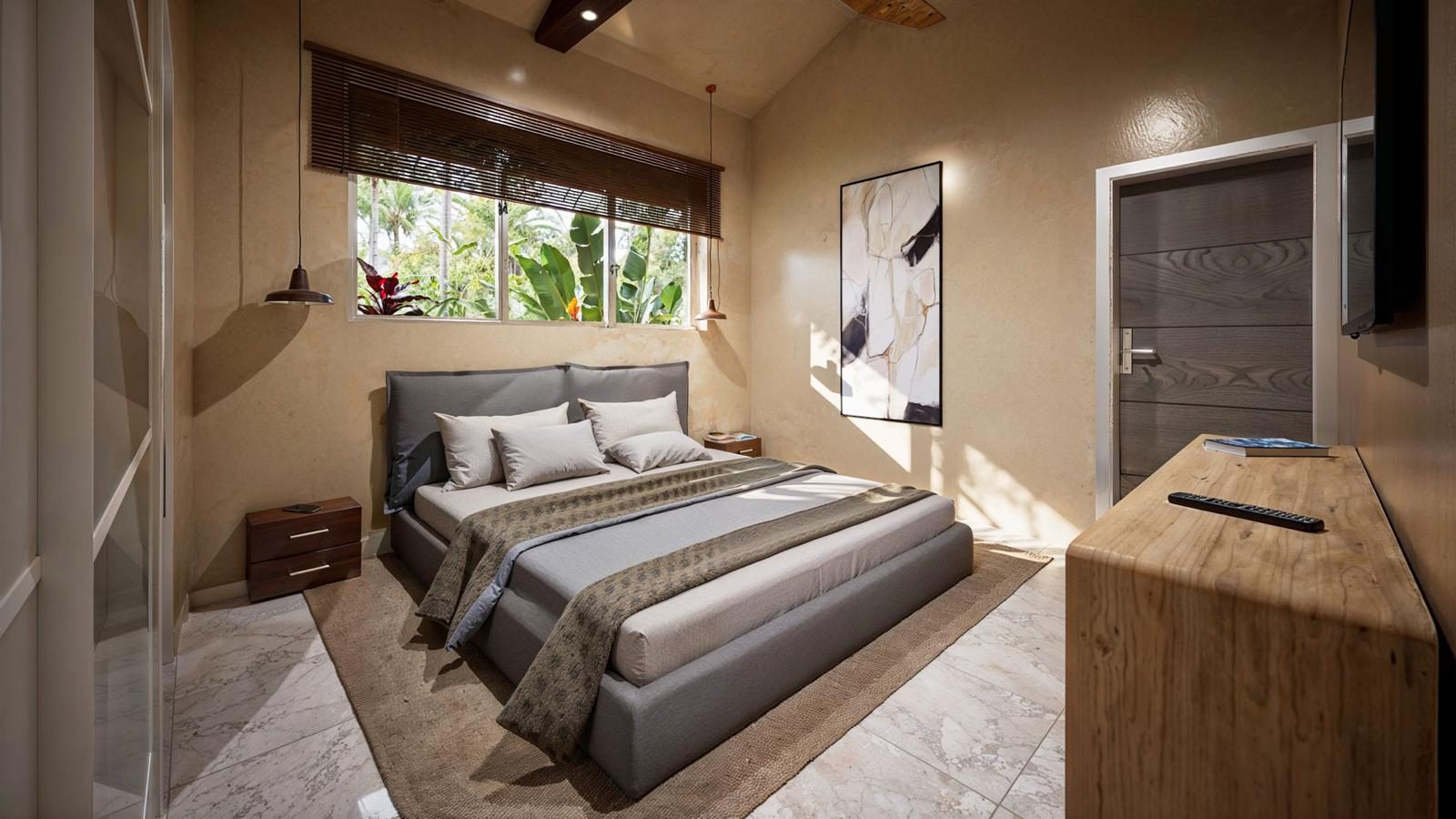 Bedroom with warm timber accents and garden view