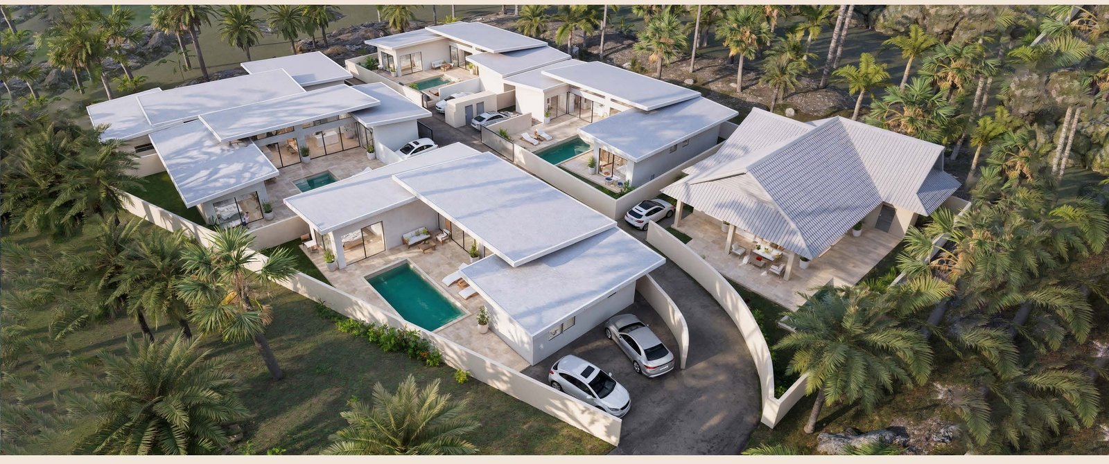 Aerial view of the six-villa pool enclave among the palms