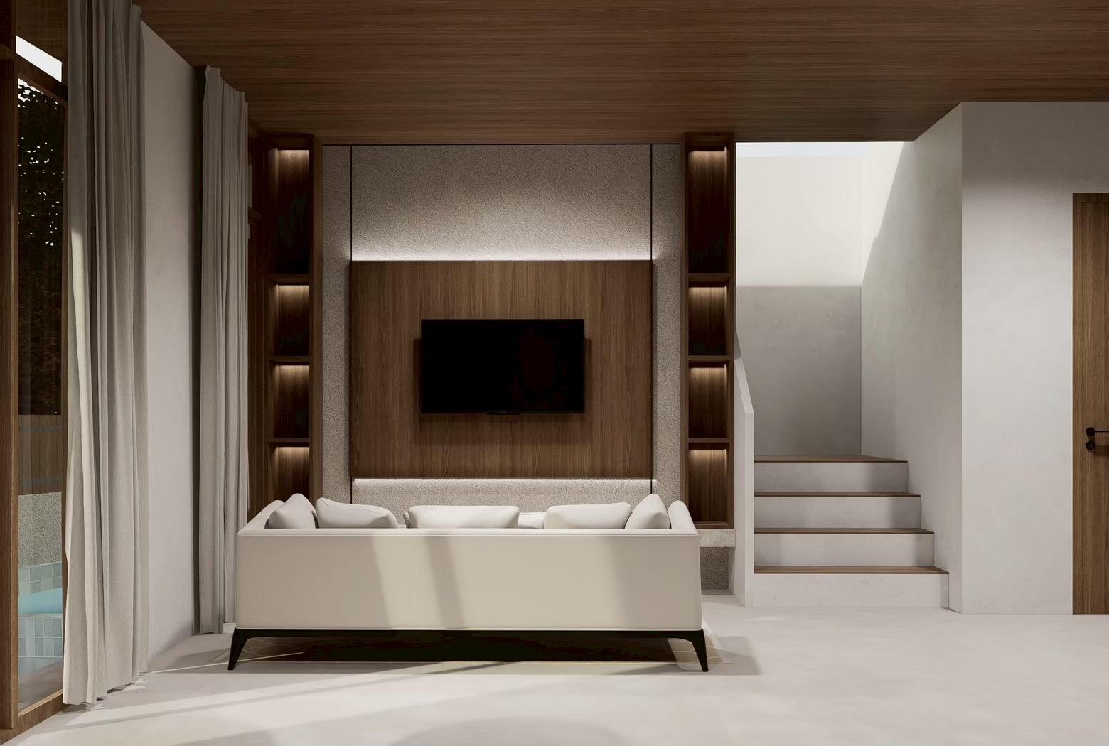 Living room with a timber feature wall and the staircase beyond