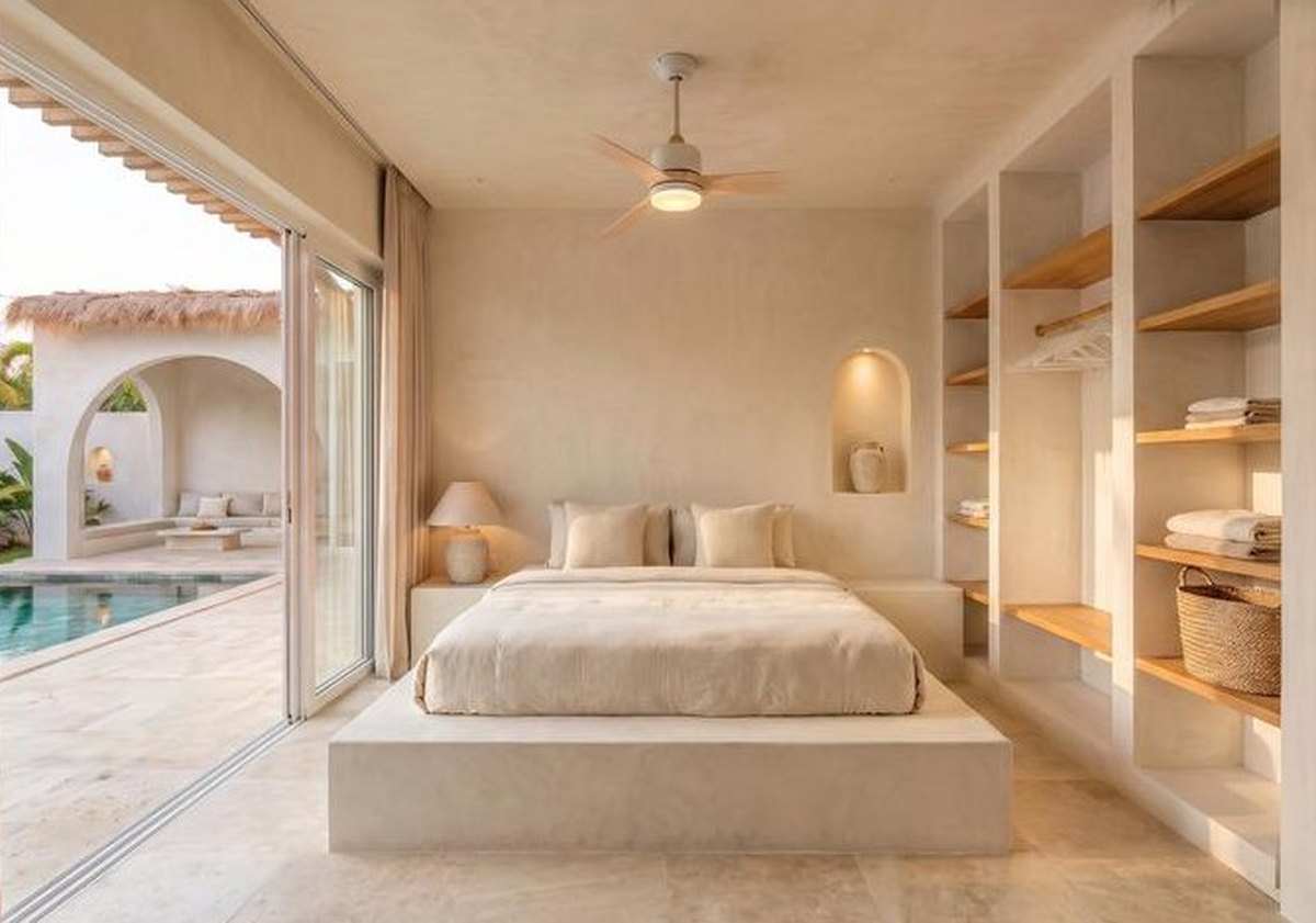 Bedroom with open shelving and sliding doors to the pool
