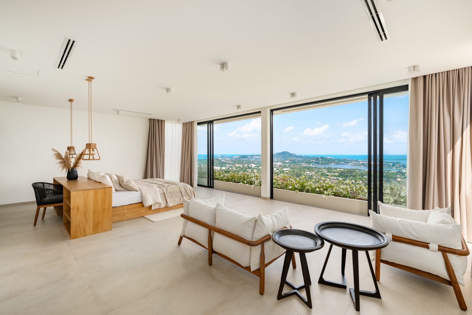 Living room with full-height glass to the sea