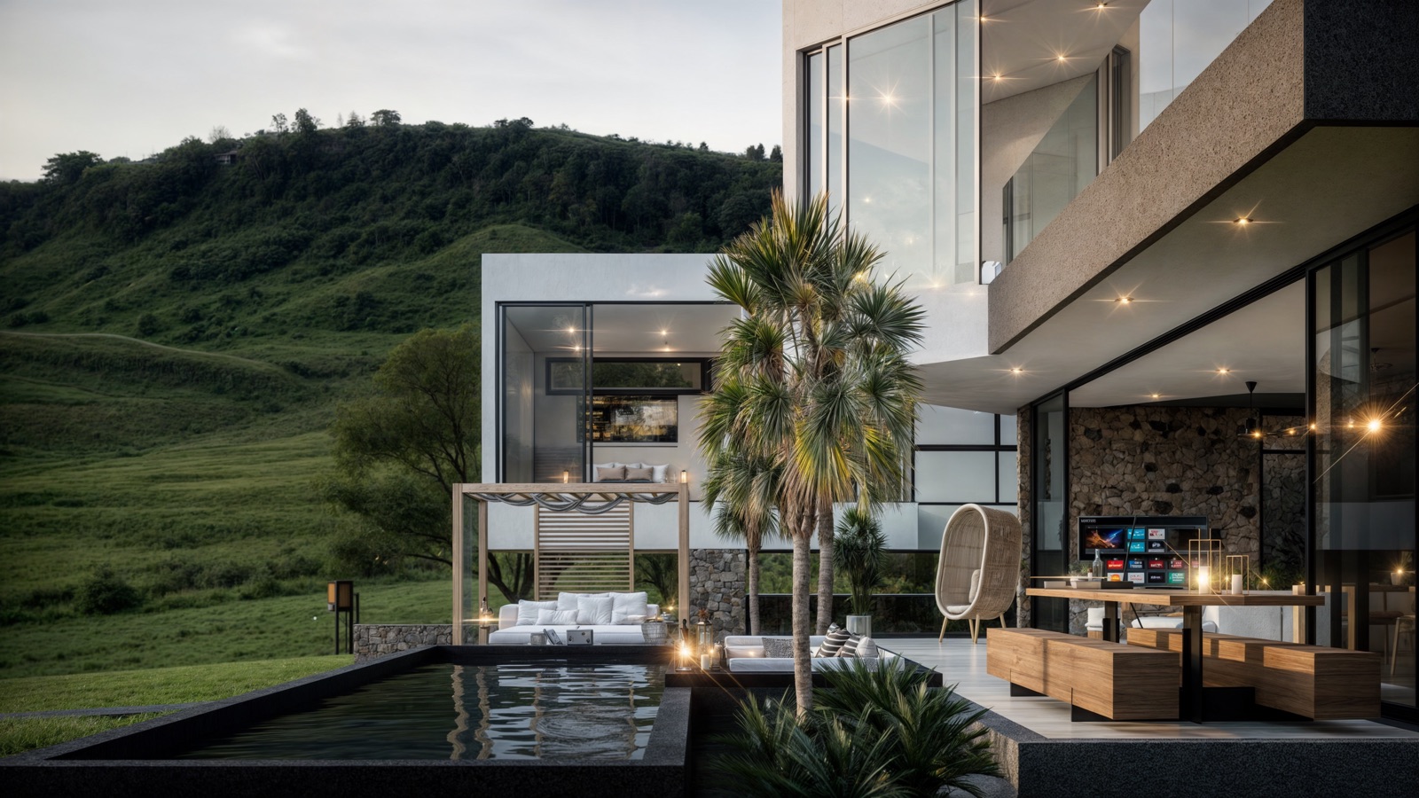 Outdoor lounge and sunken pool with a hillside view