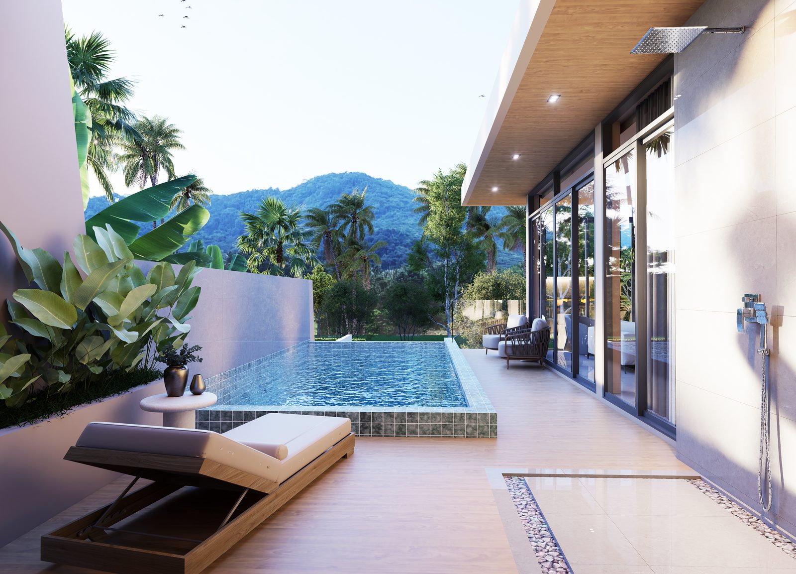 Pool terrace with a lounger under the roof overhang