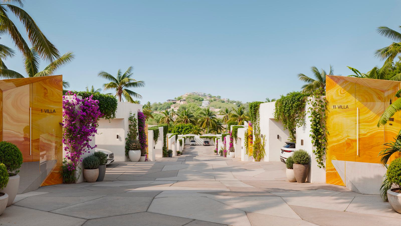 Entrance approach with planted walls and villa gates