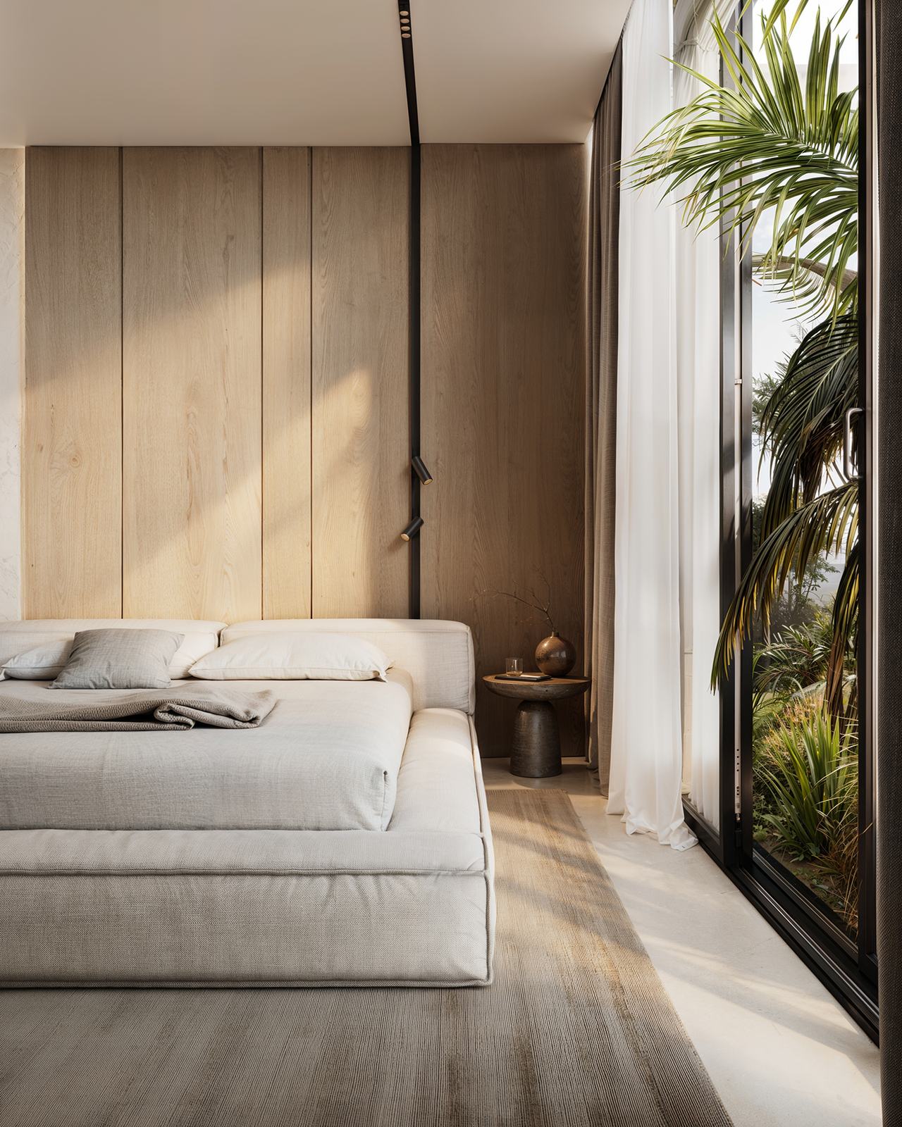 Bedroom with a timber wall and glass to the planted courtyard