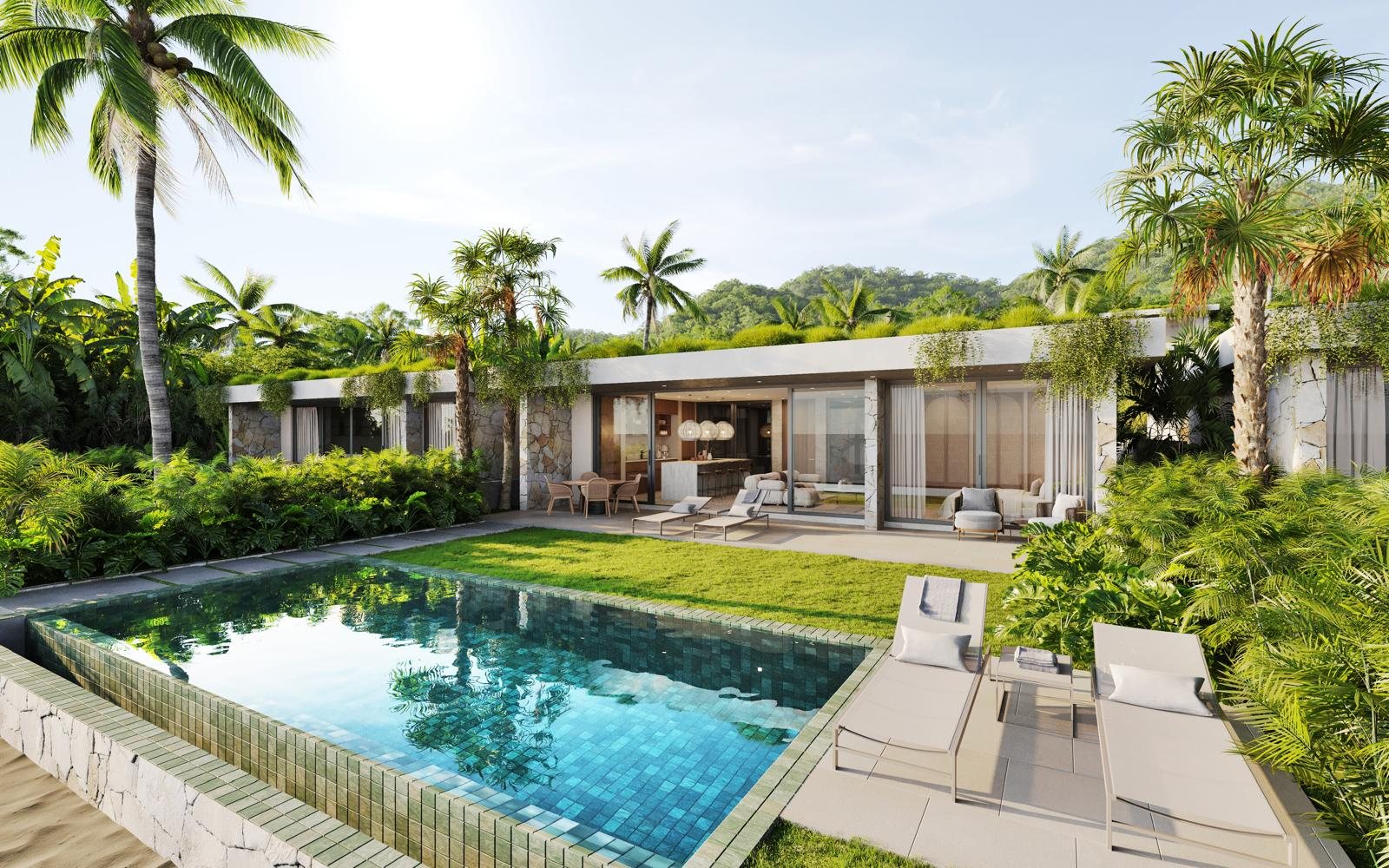 Infinity pool, lawn and sun loungers beside the living pavilion