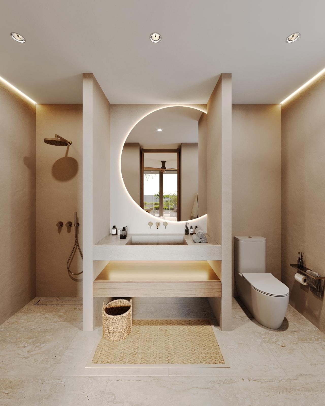 En-suite bathroom with a round mirror and walk-in shower