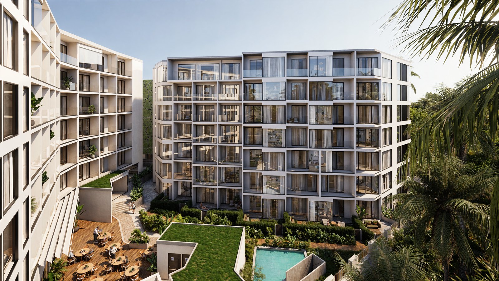Courtyard between two buildings with a garden pool and a dining terrace