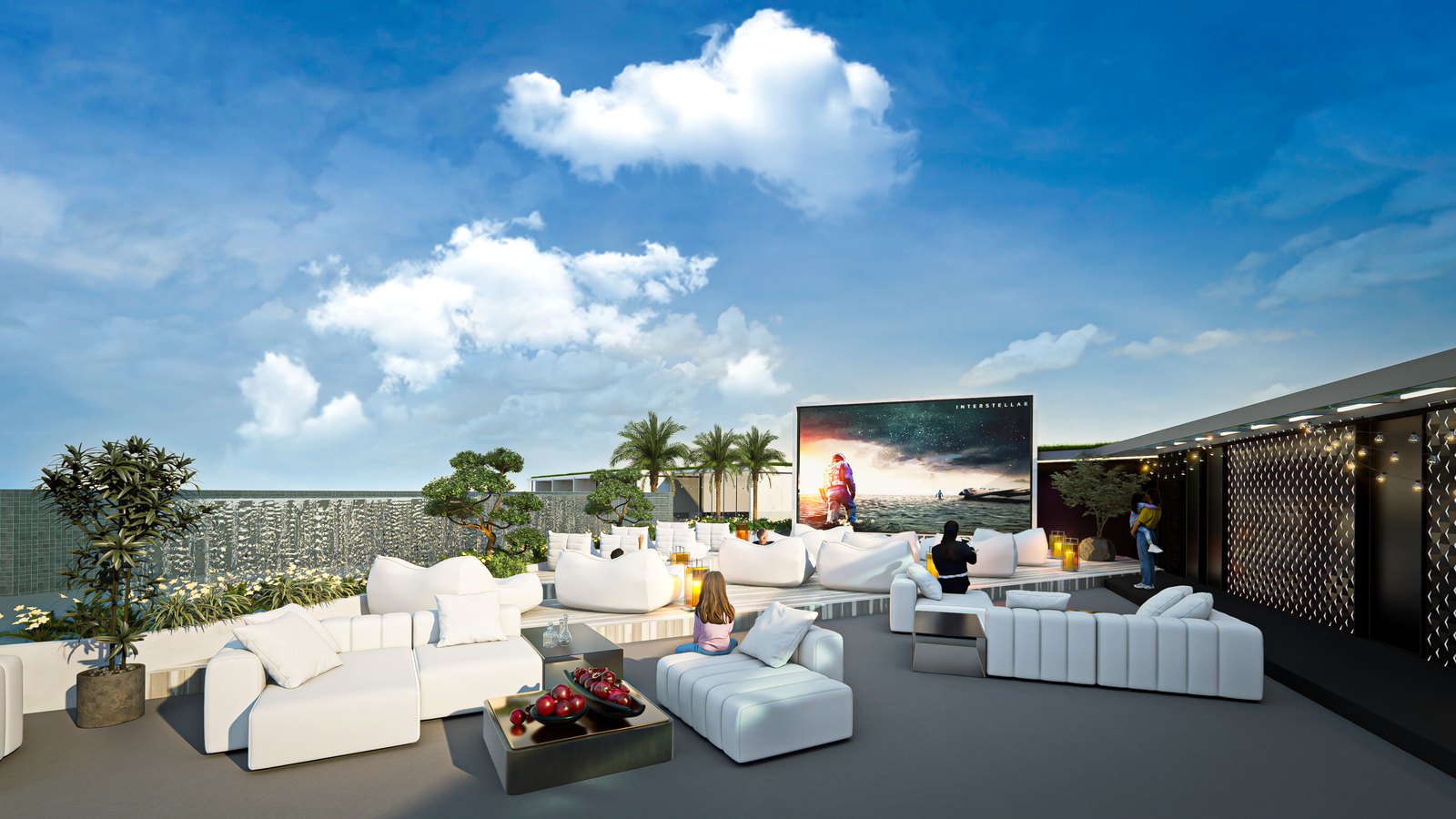 Open-air cinema on the roof with deep white sofas