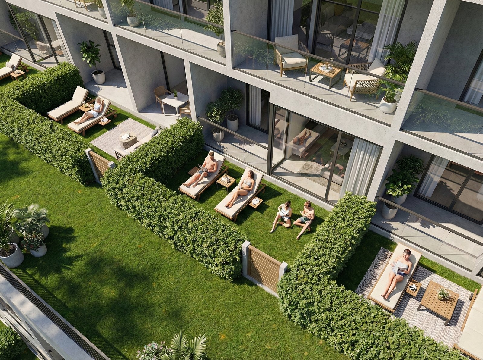 Ground-floor apartments opening onto private lawns with loungers