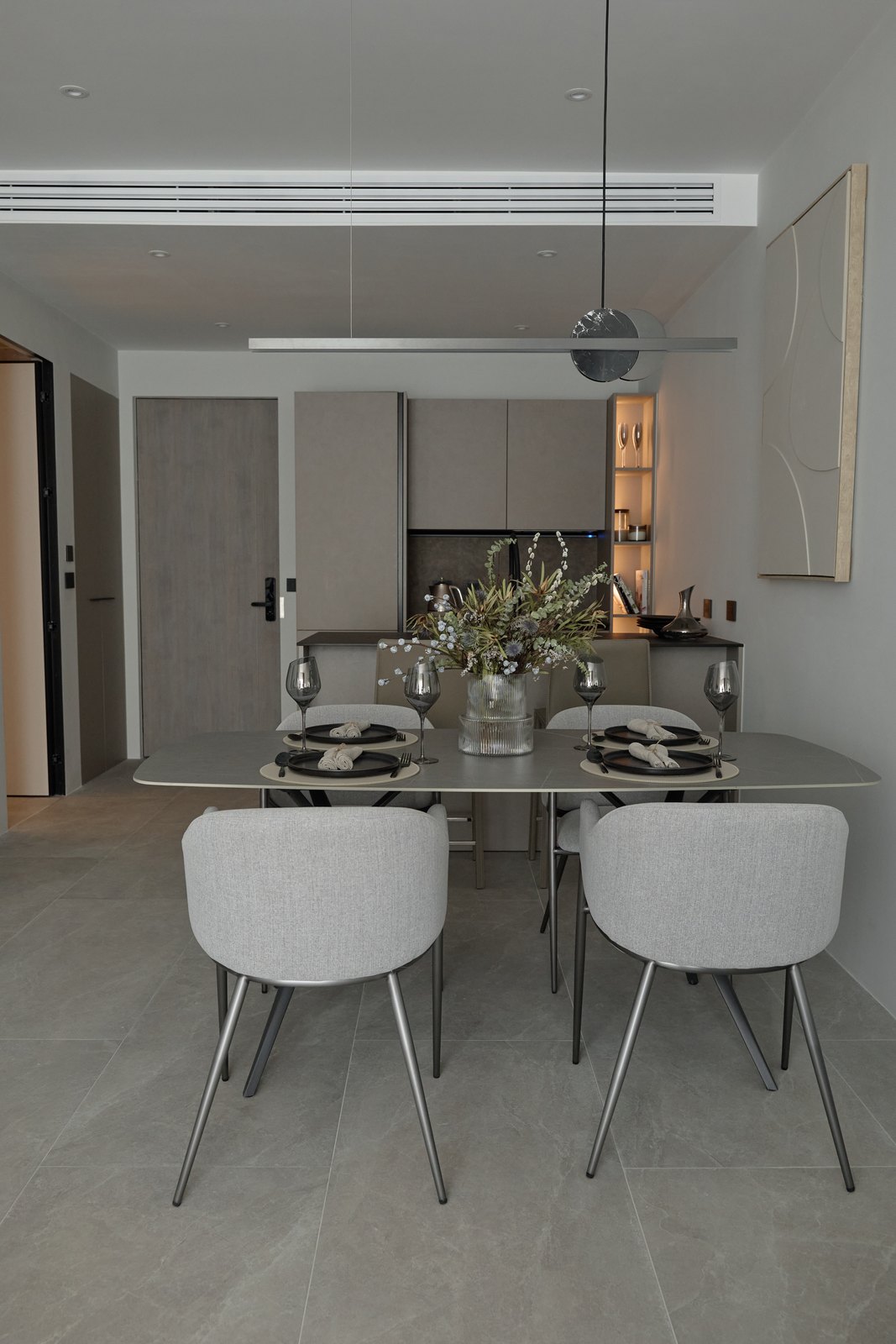 Show apartment: dining table and fitted kitchen
