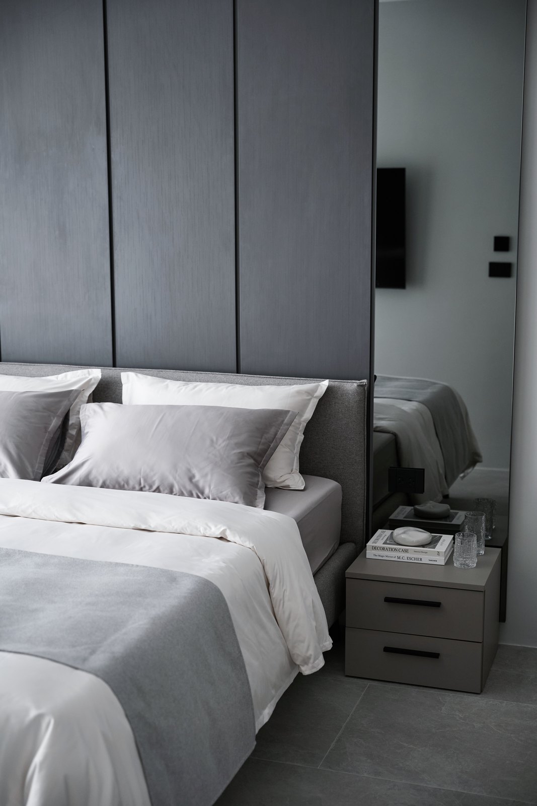 Show apartment: bedroom with an upholstered headboard