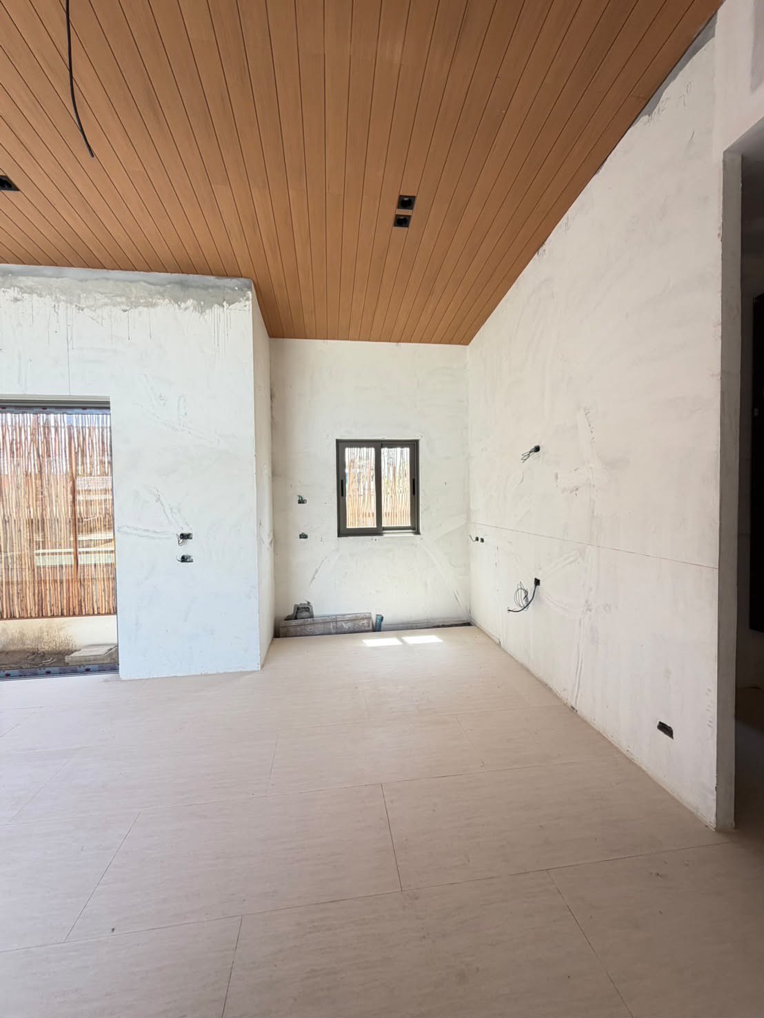 The pool tiled and the terrace poured, seen from the entrance