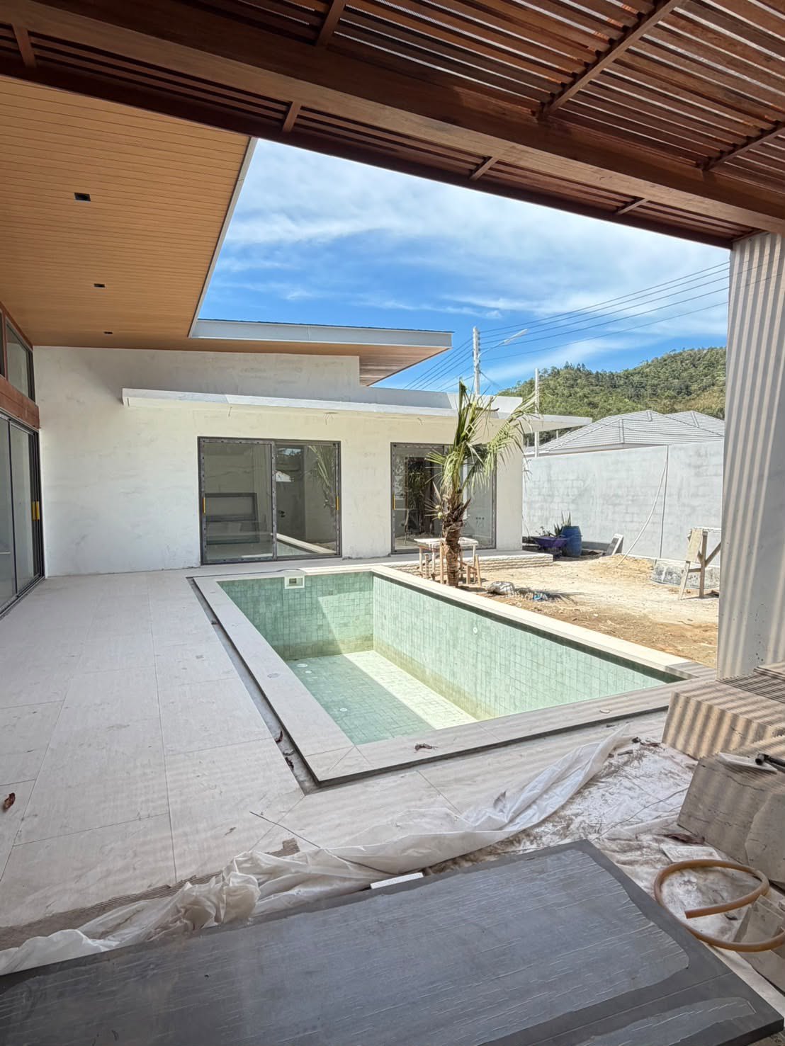 The corner of the pool and the bedroom wing