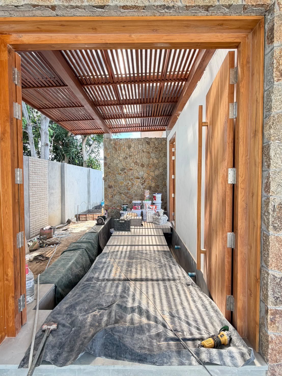 The covered walkway along the side of the house