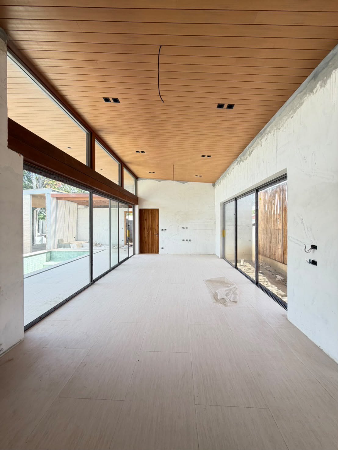 The living room with full-height glass to the terrace