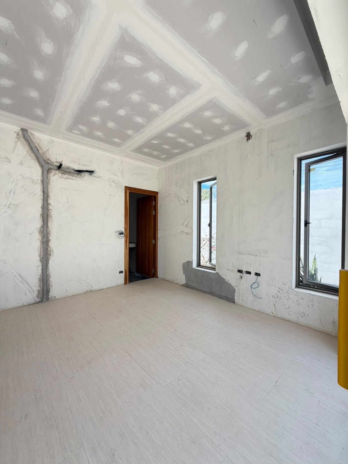 A bedroom before finishing, with the window to the garden